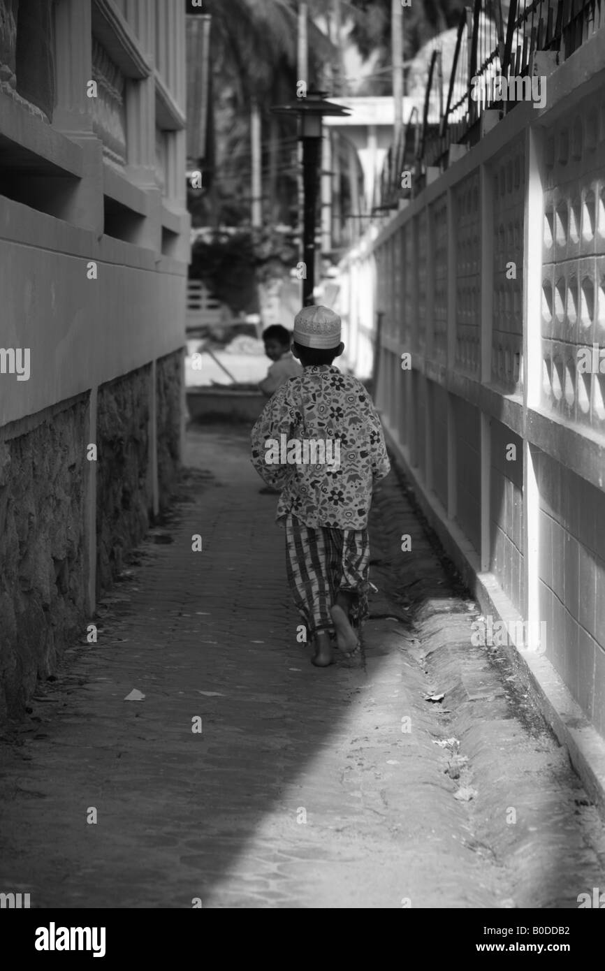 young muslim boy, running around , koh samui muslim community, thailand Stock Photo
