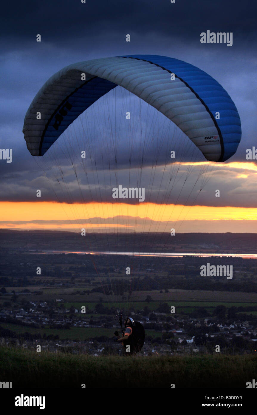 A PARAGLIDER TAKING OFF FROM SELSLEY COMMON ABOVE THE RIVER SEVERN