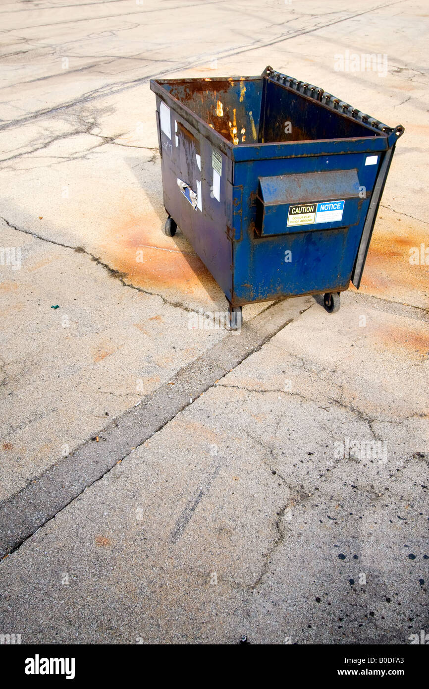 A dumpster in a parking lot. Stock Photo