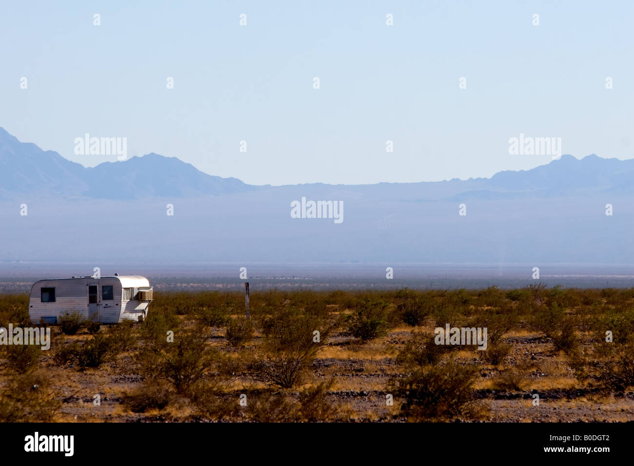 A lone camper trailer sits in the Mojave Desert, along Rt. 66 near