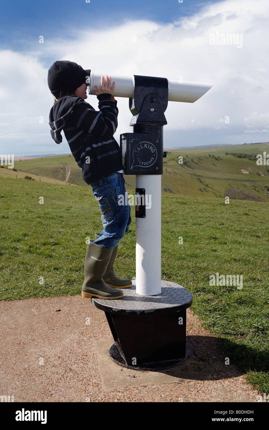 Boy looking through telescope Stock Photo - Alamy