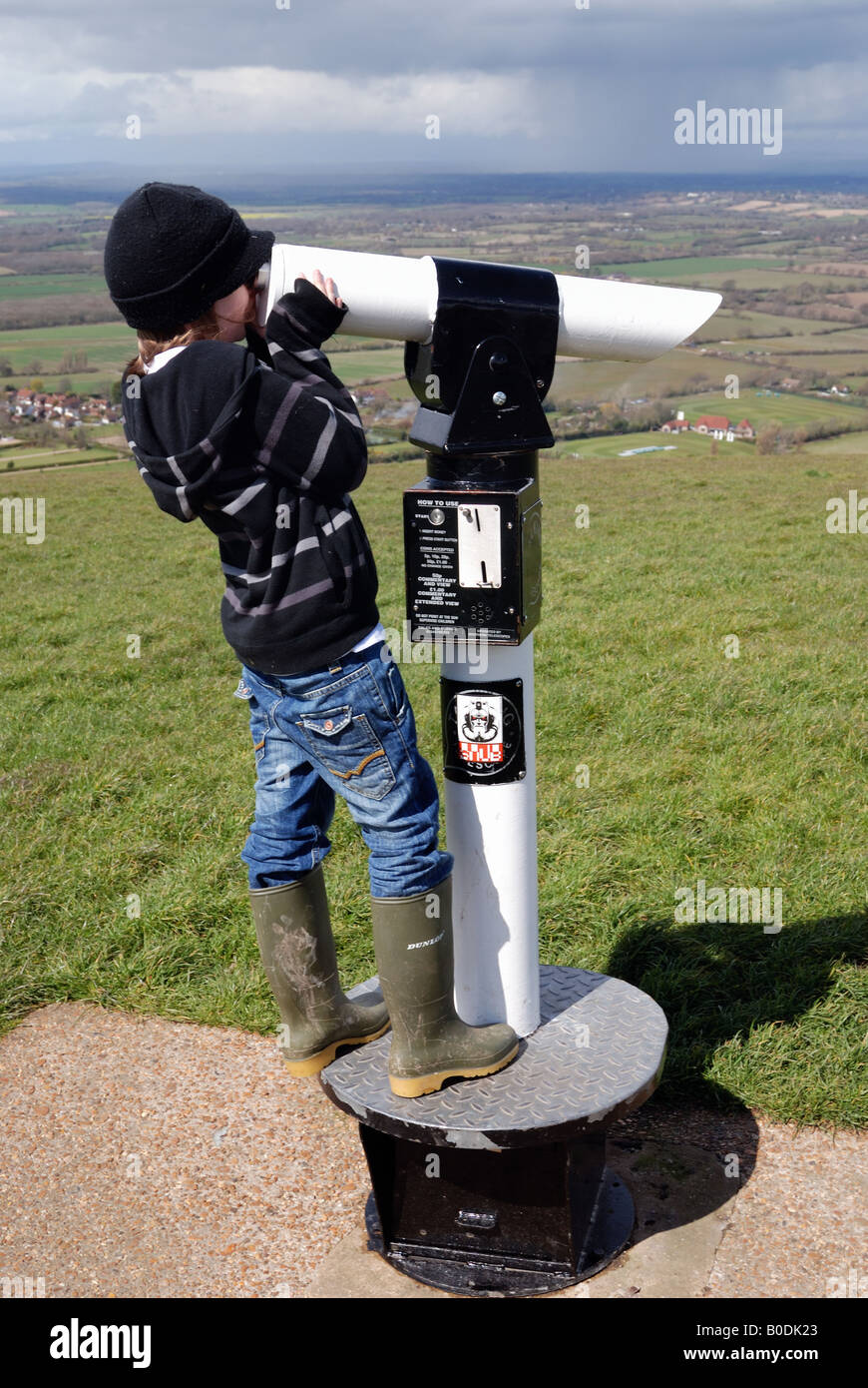 Boy looking through telescope Stock Photo - Alamy