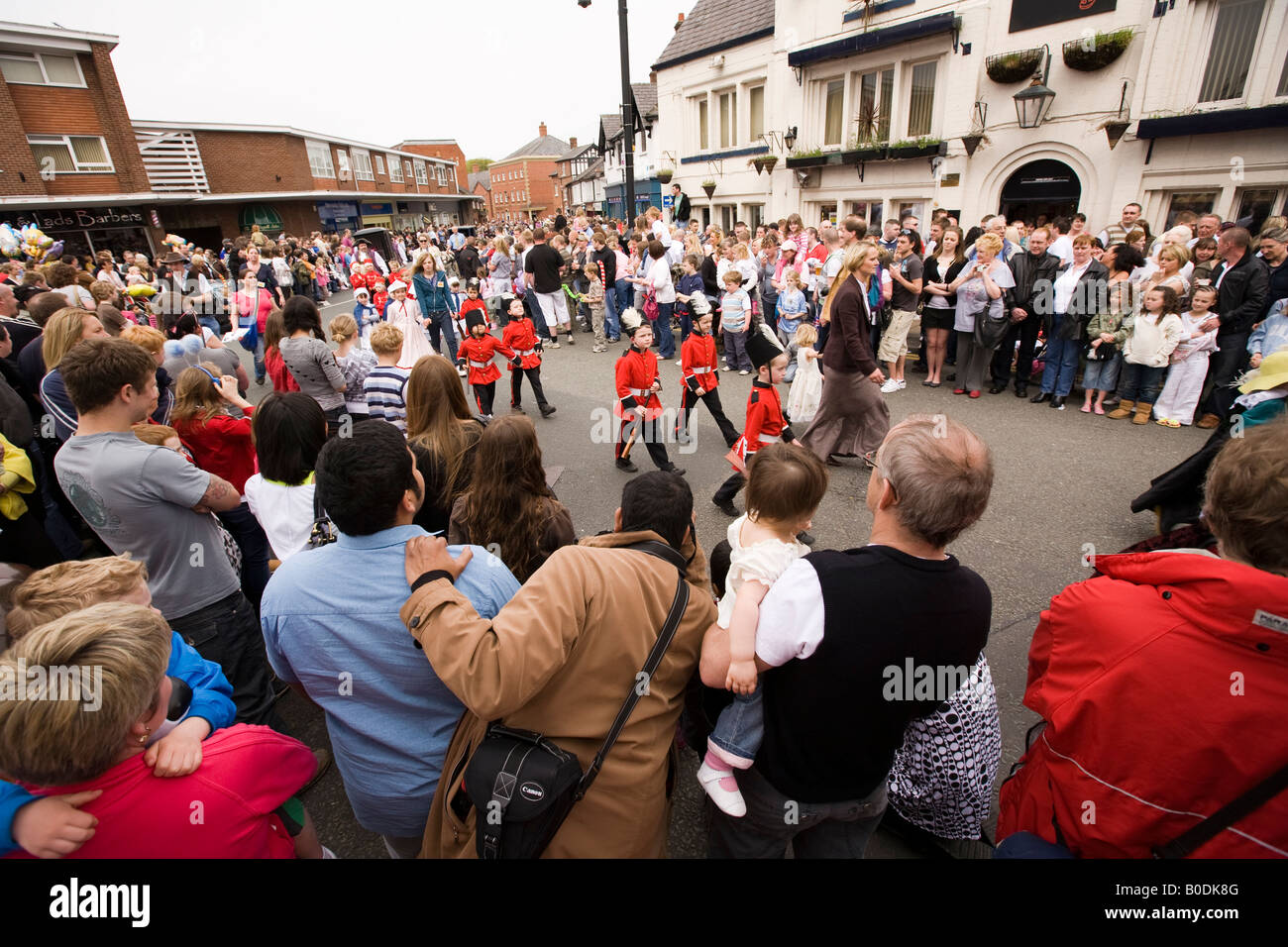 UK Cheshire Knutsford Canute Place crowd watching Royal May Day Procession Stock Photo