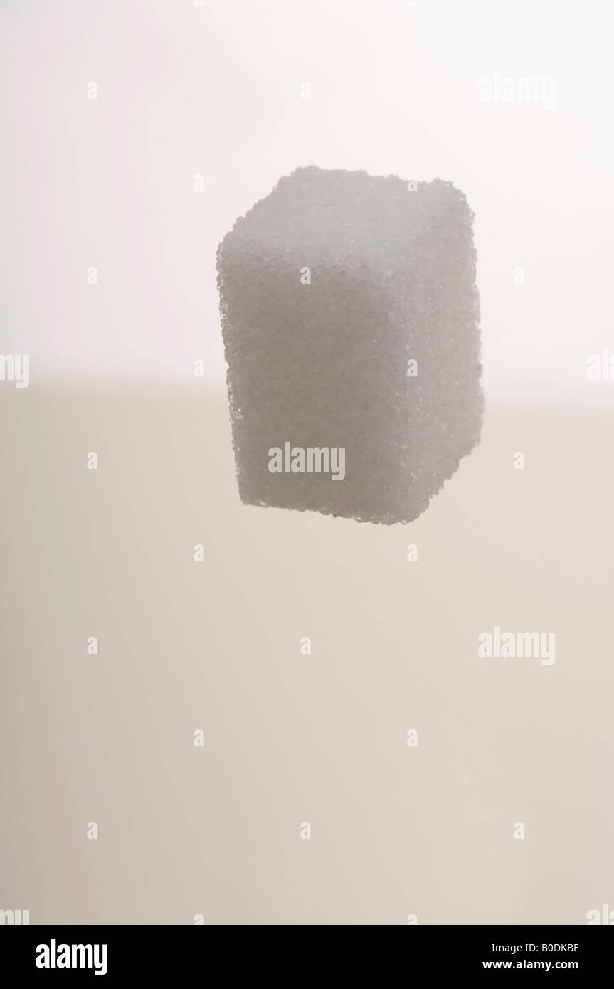 Sugar cube falling Stock Photo Alamy