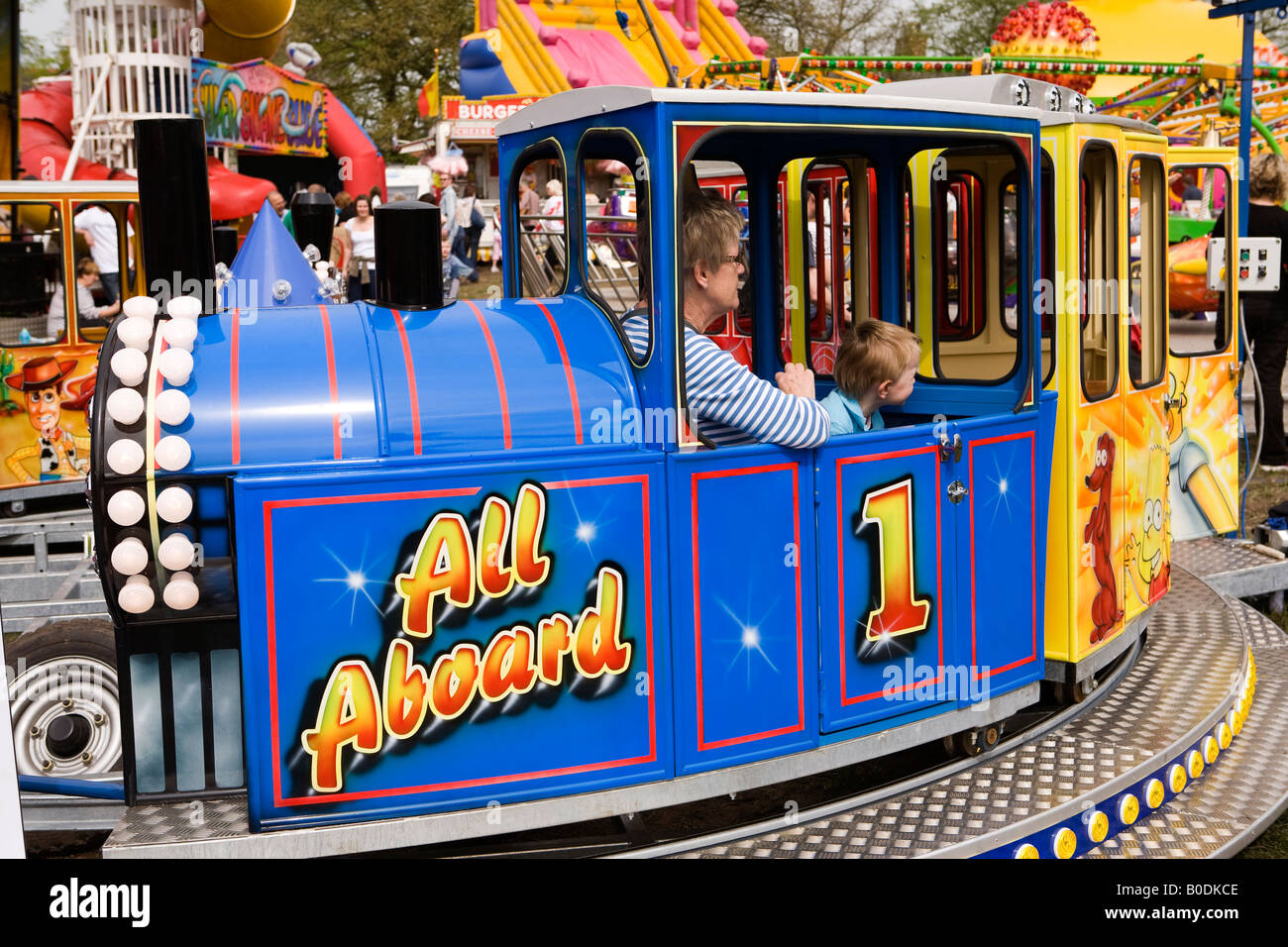 UK Cheshire Knutsford The Heath Royal May Day funfair woman and child