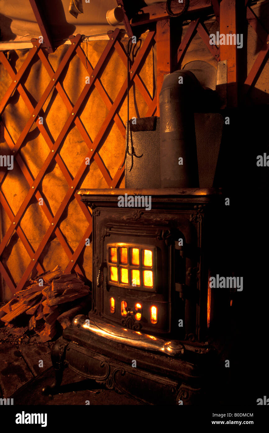 Fire blazes in the stove, Grass Creek Yurt, Never Summer Nordic, Colorado State Forest, Gould, Colorado. Stock Photo