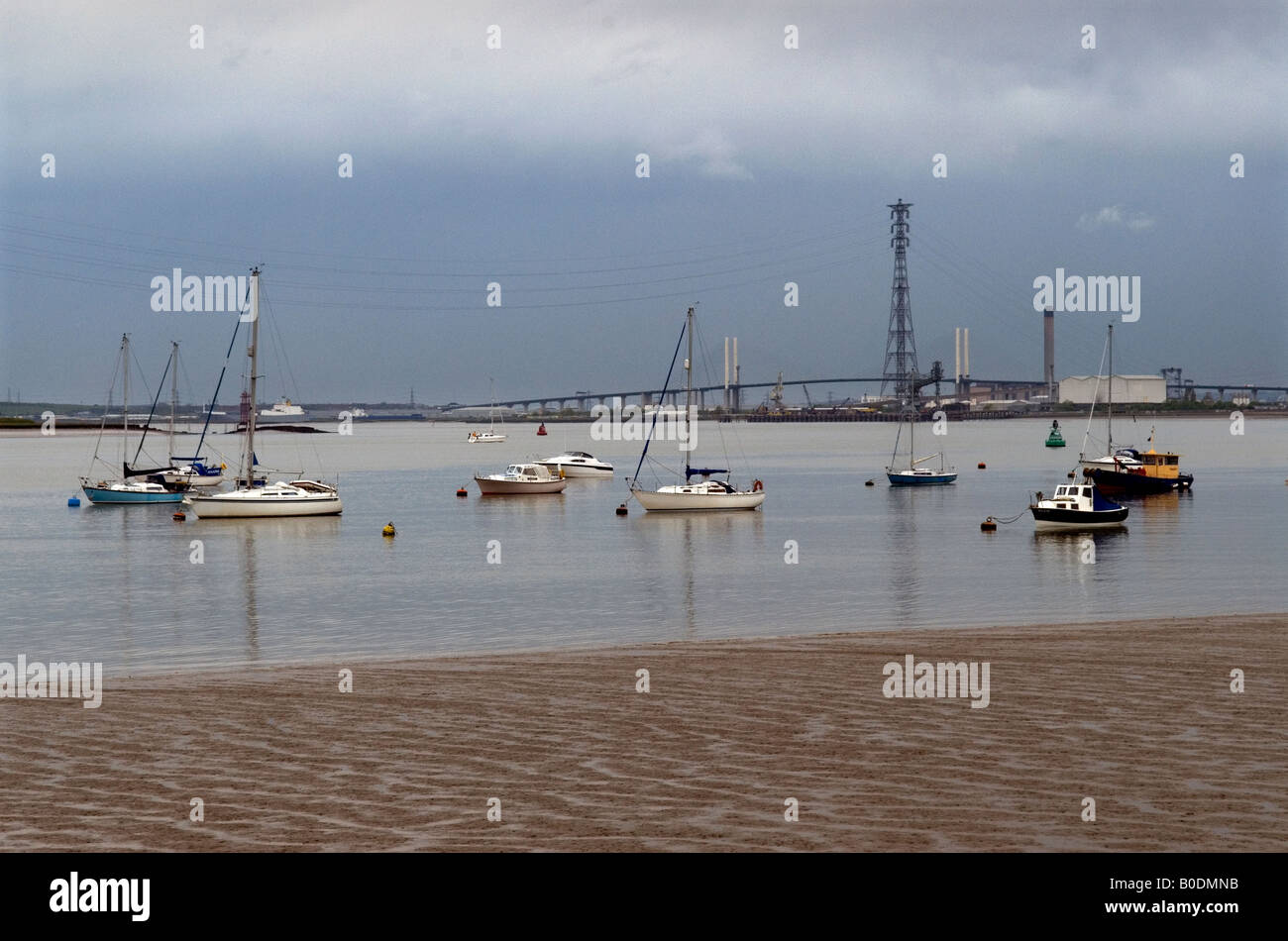 The River Thames at Grays in Essex showing yachts and the QE11 Bridge