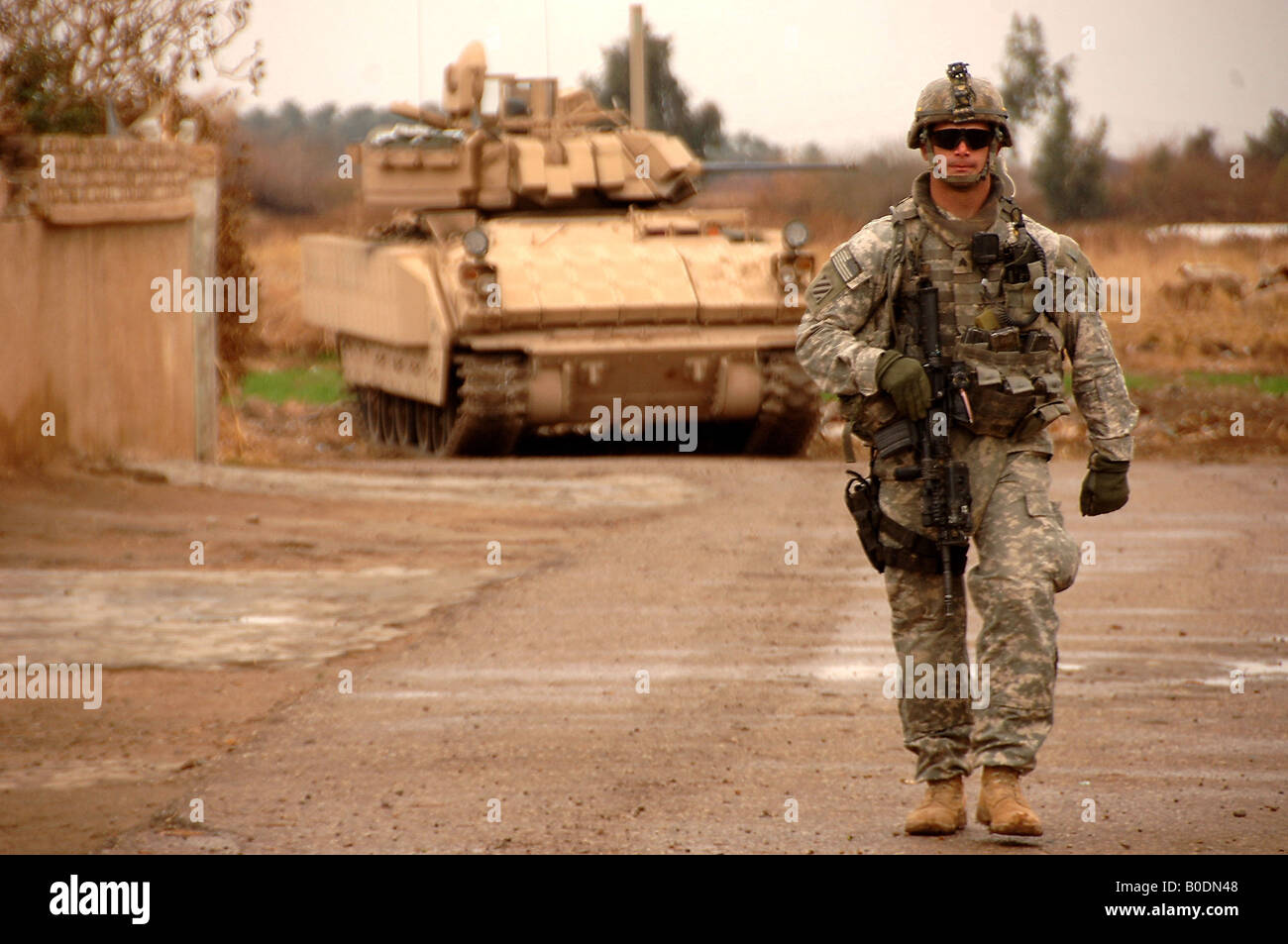 A U S Army soldier patrols on foot through a village southeast of Salman Pak Iraq on Feb 15 2008. Stock Photo