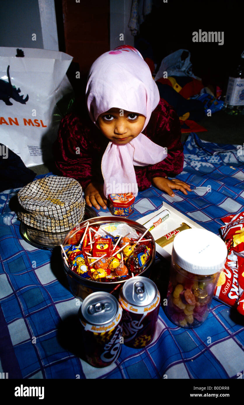 Peckham London Inside The Mosque Eid Market Child With Sweets Stock Photo