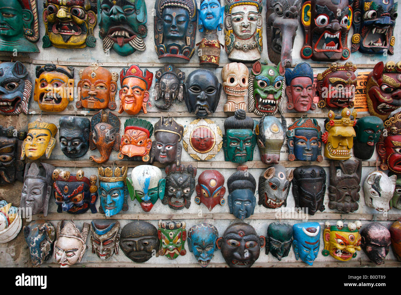 masks on wall in nepal Stock Photo Alamy