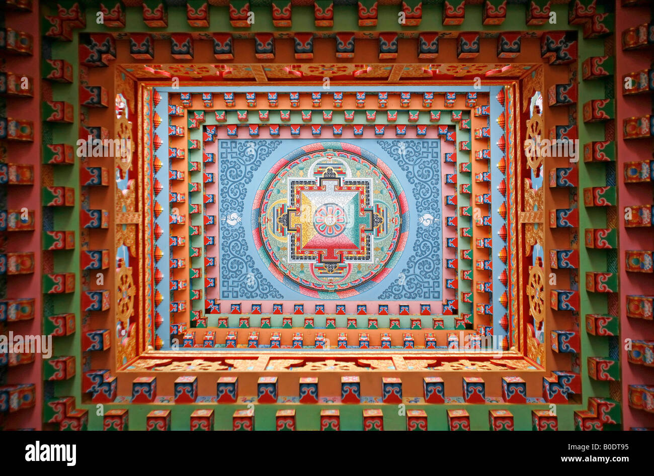 Tibetan mandala painting on monestery ceiling Upper Pisang Nepal Stock Photo