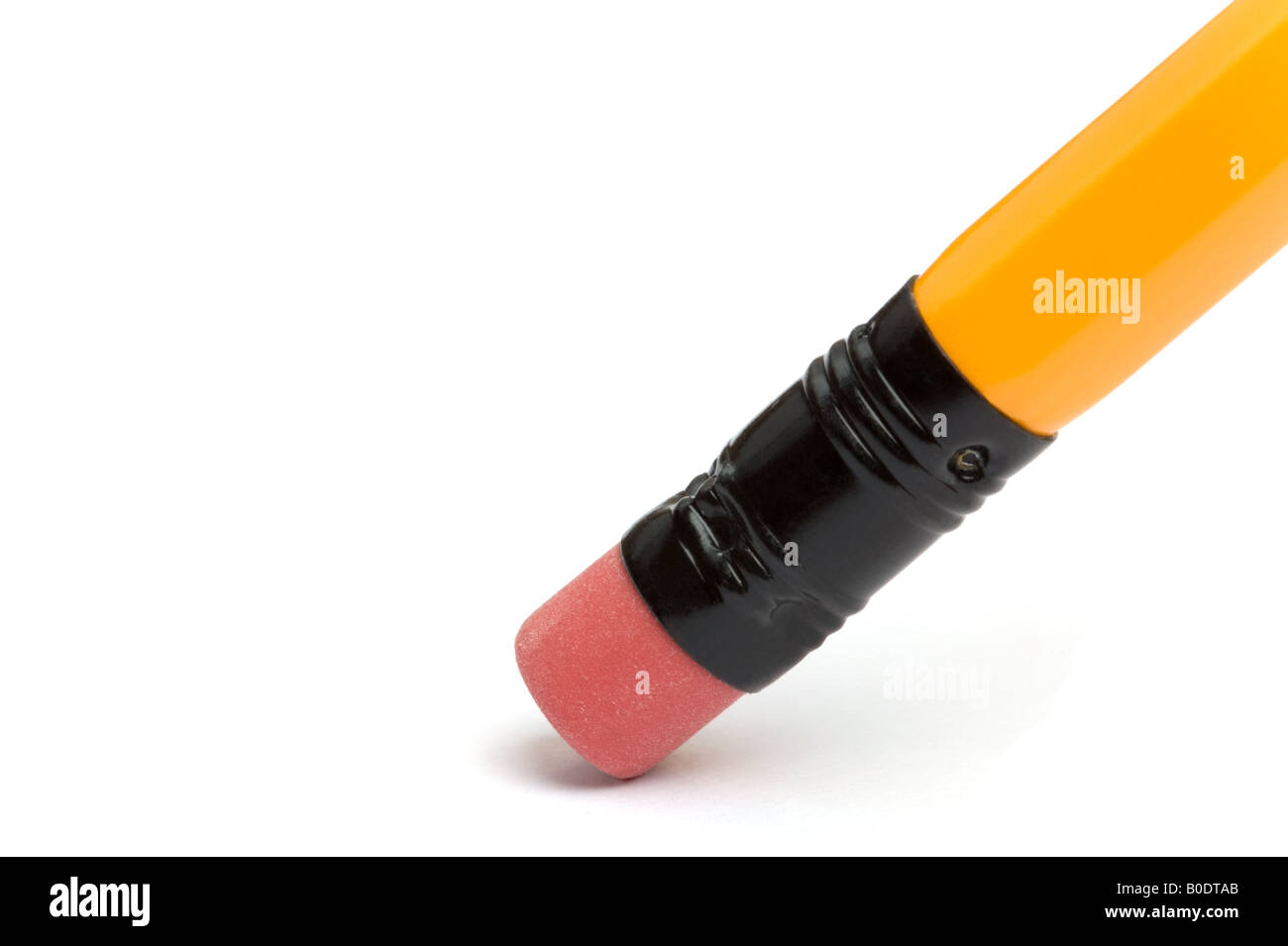 Close up of the eraser at the end of a yellow pencil Stock Photo
