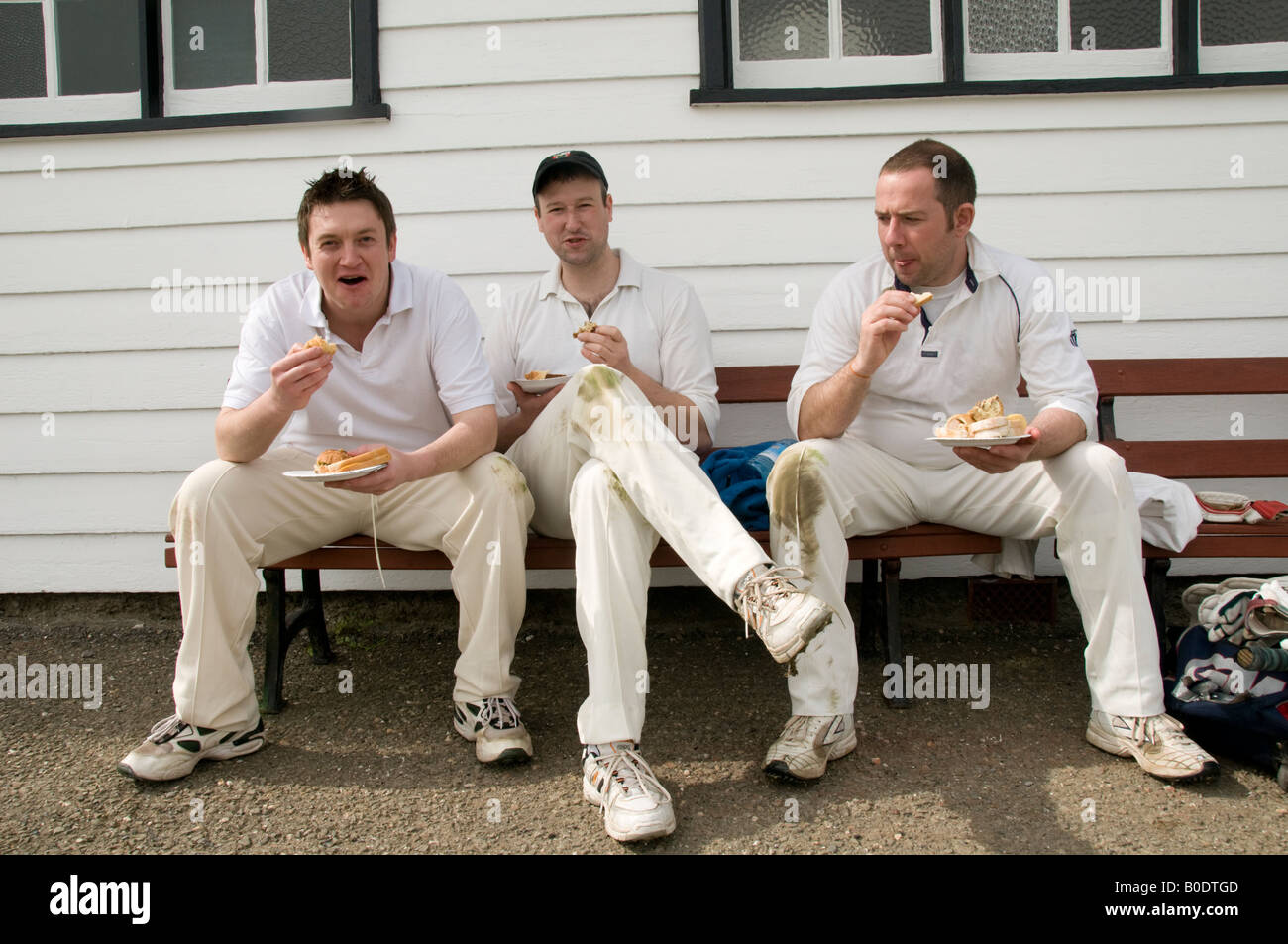three cricketer enjoying Tea interval at a local amateur cricket match