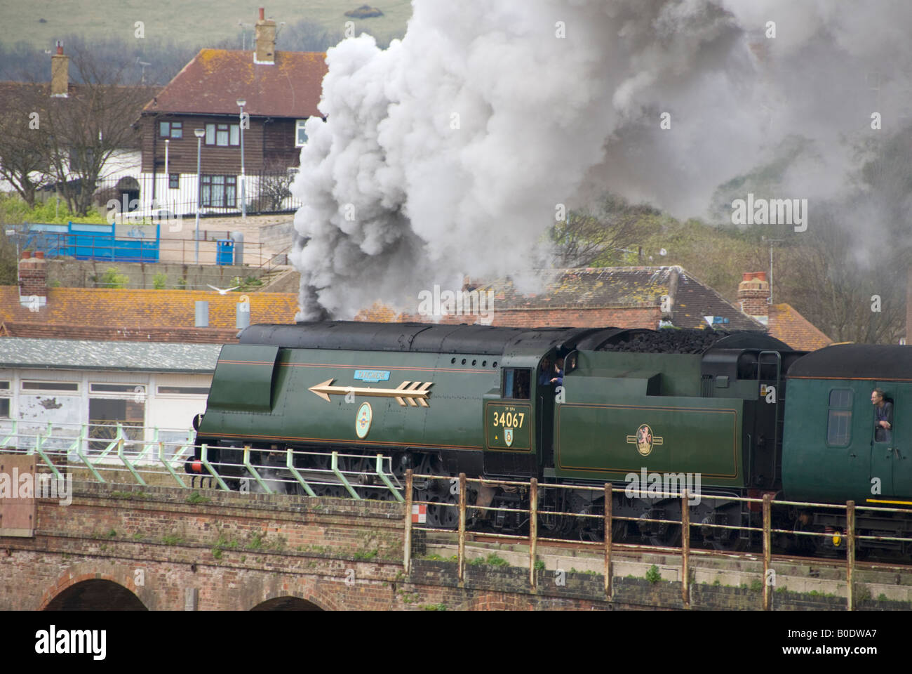 A steam charter train headed by 34067 'Tangmere' leaving Folkestone Harbour. Stock Photo