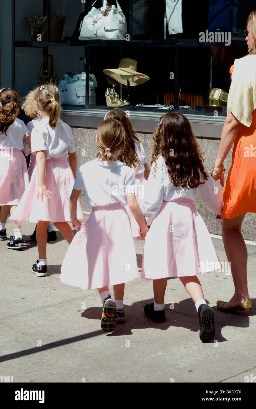 girls holding hands Stock Photo - Alamy
