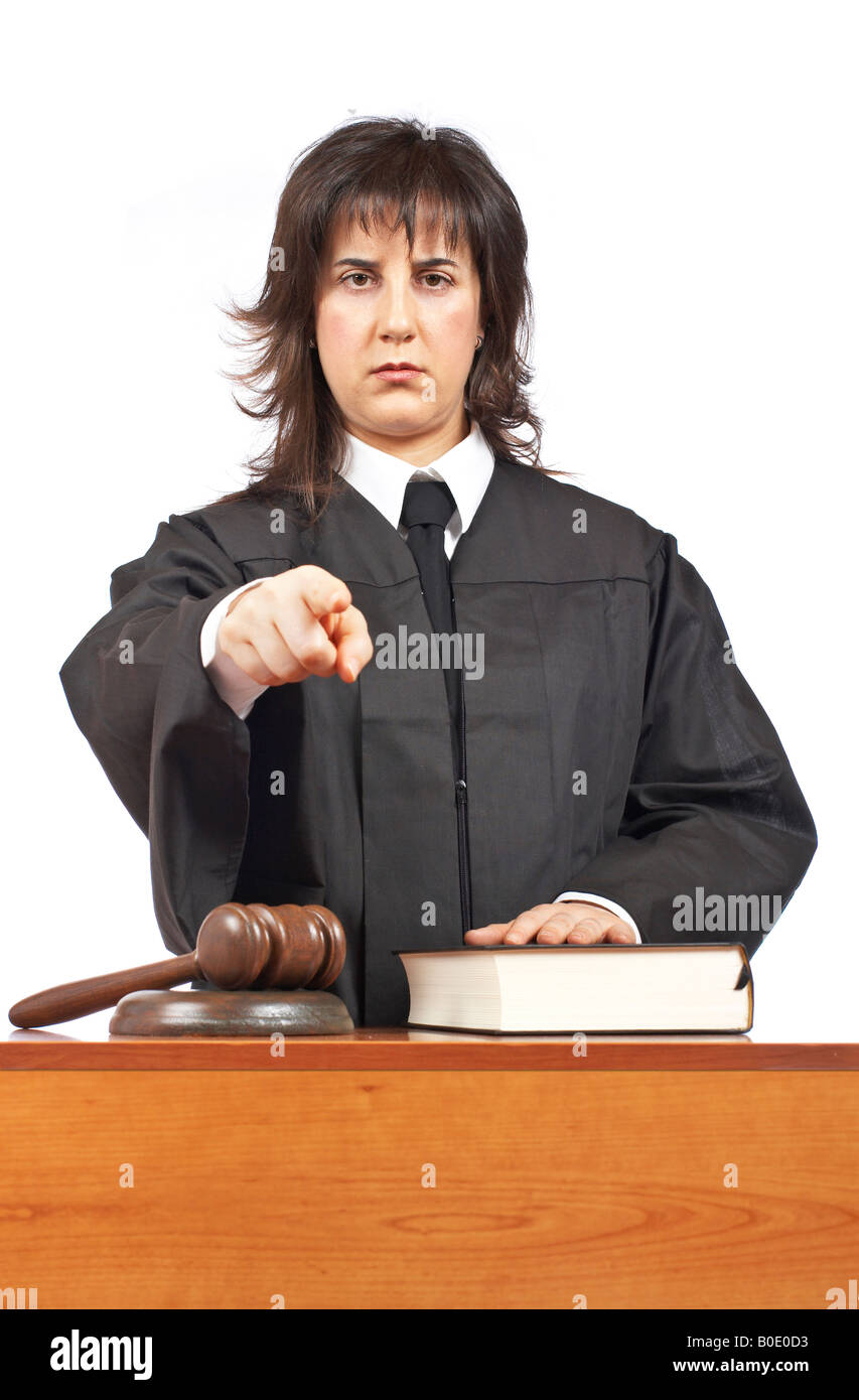 Angry female judge pointing at you in a courtroom Focus on gavel and