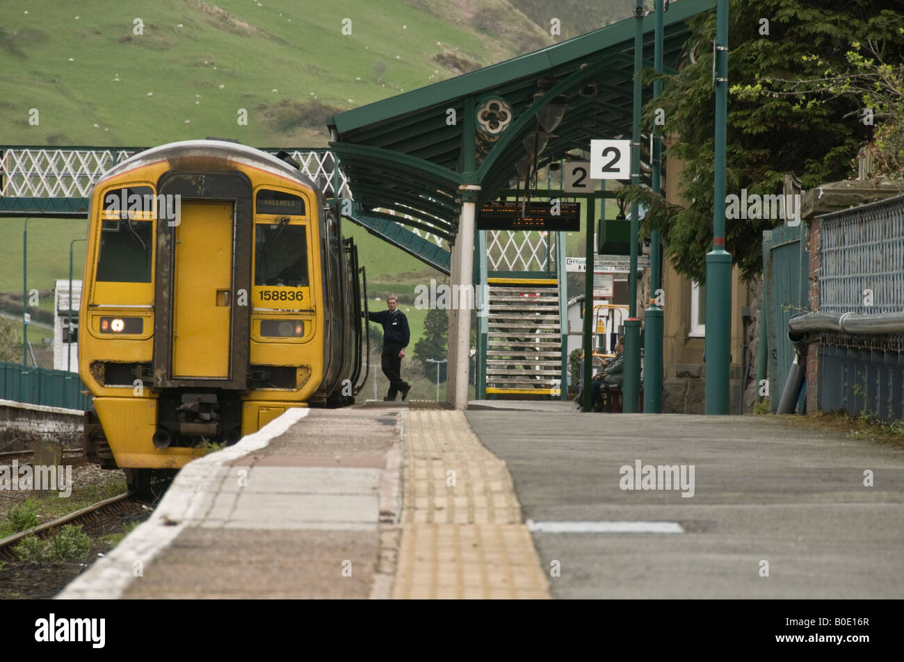 Small Arriva Wales DMU Diesel Train Standing At The Platform At ...