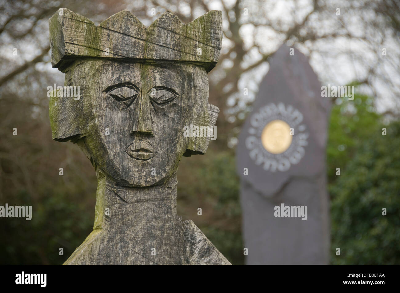 Carved wooden figure weathered over time representing a mythical celtic king Machynlleth Powys Wales UK Stock Photo