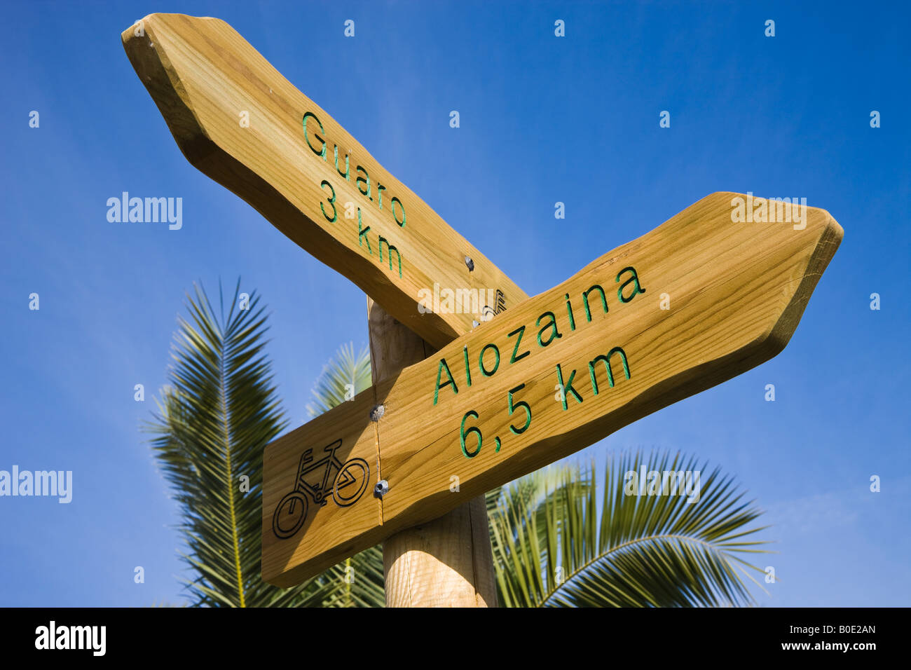 Sign pointing to bicycle tracks to Guaro and Alozaina in Parque Natural Sierra de las Nieves Malaga Province Spain Stock Photo