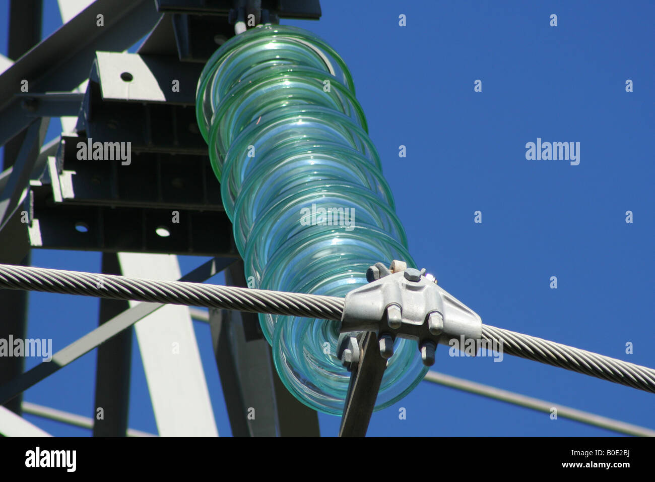 Glass insulator on high voltage power pylon Stock Photo Alamy