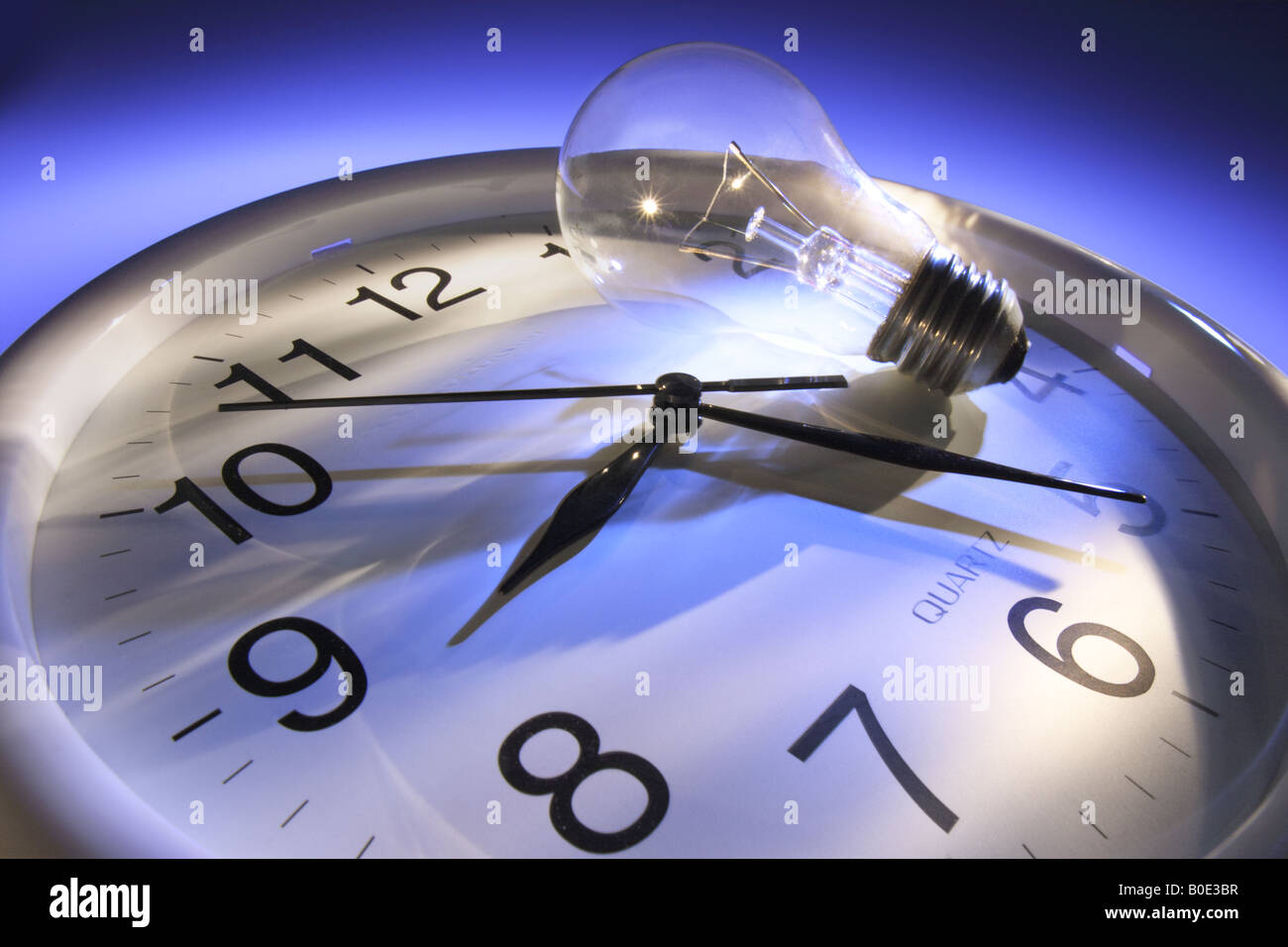 Light Bulb on Clock Stock Photo Alamy