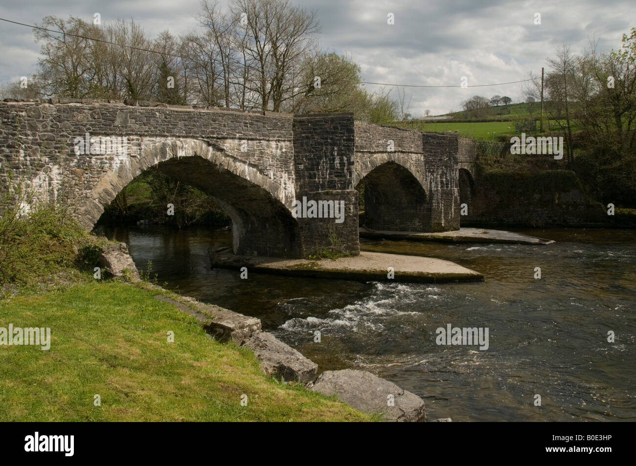 The stone two arched old bridge over the River Cothi at Abergorlech