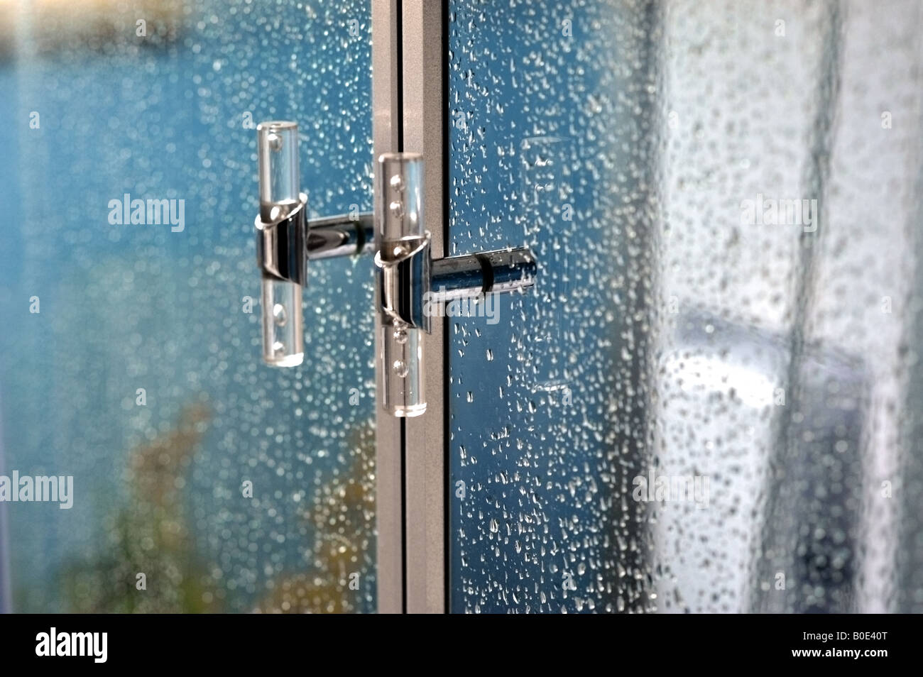 shower cubicle door handles with water droplets Stock Photo Alamy