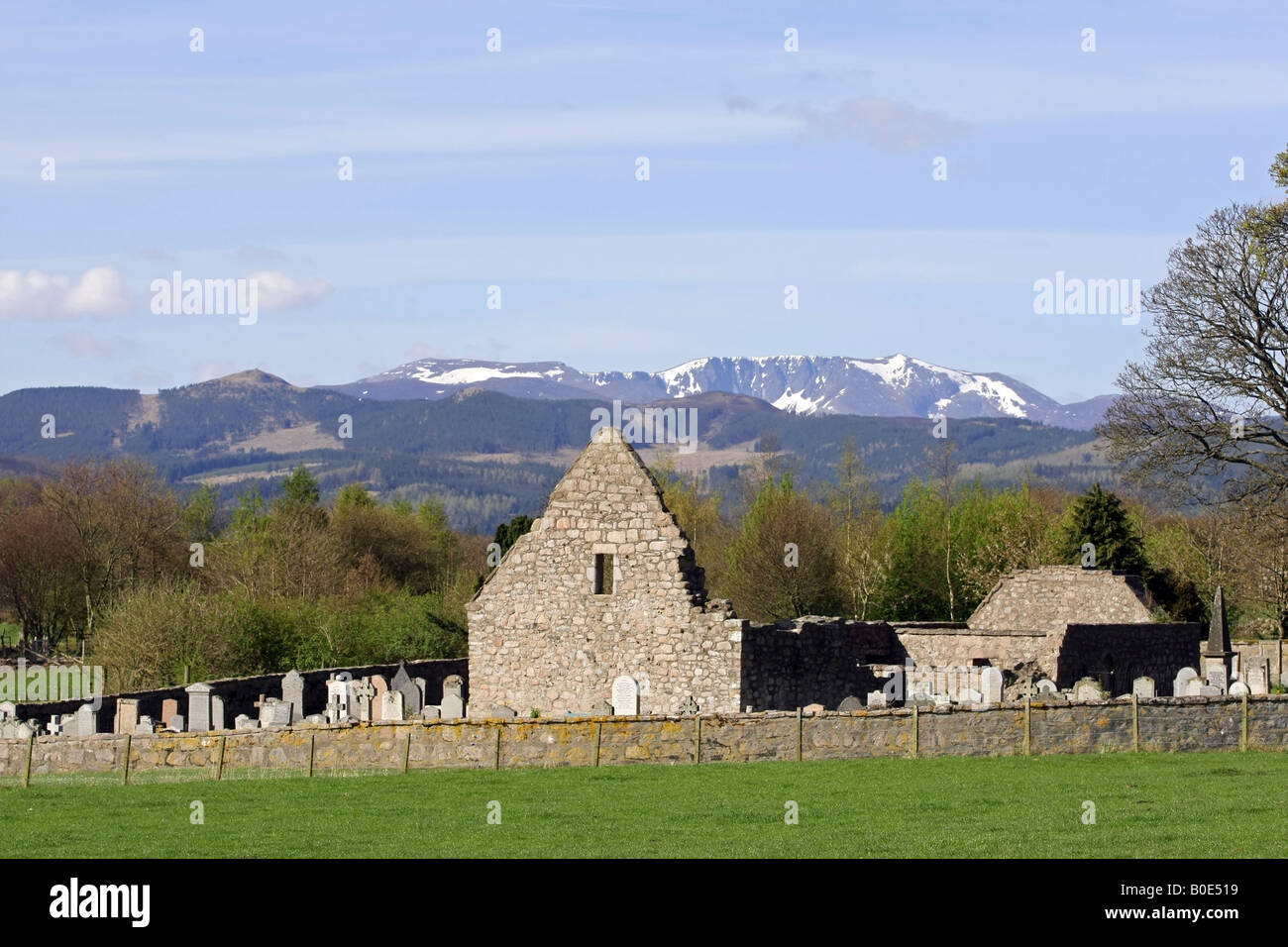The ruin of Tullich kirk near Ballater, Aberdeenshire, Scotland, with the snow capped mountain of Lochnagar in the background Stock Photo