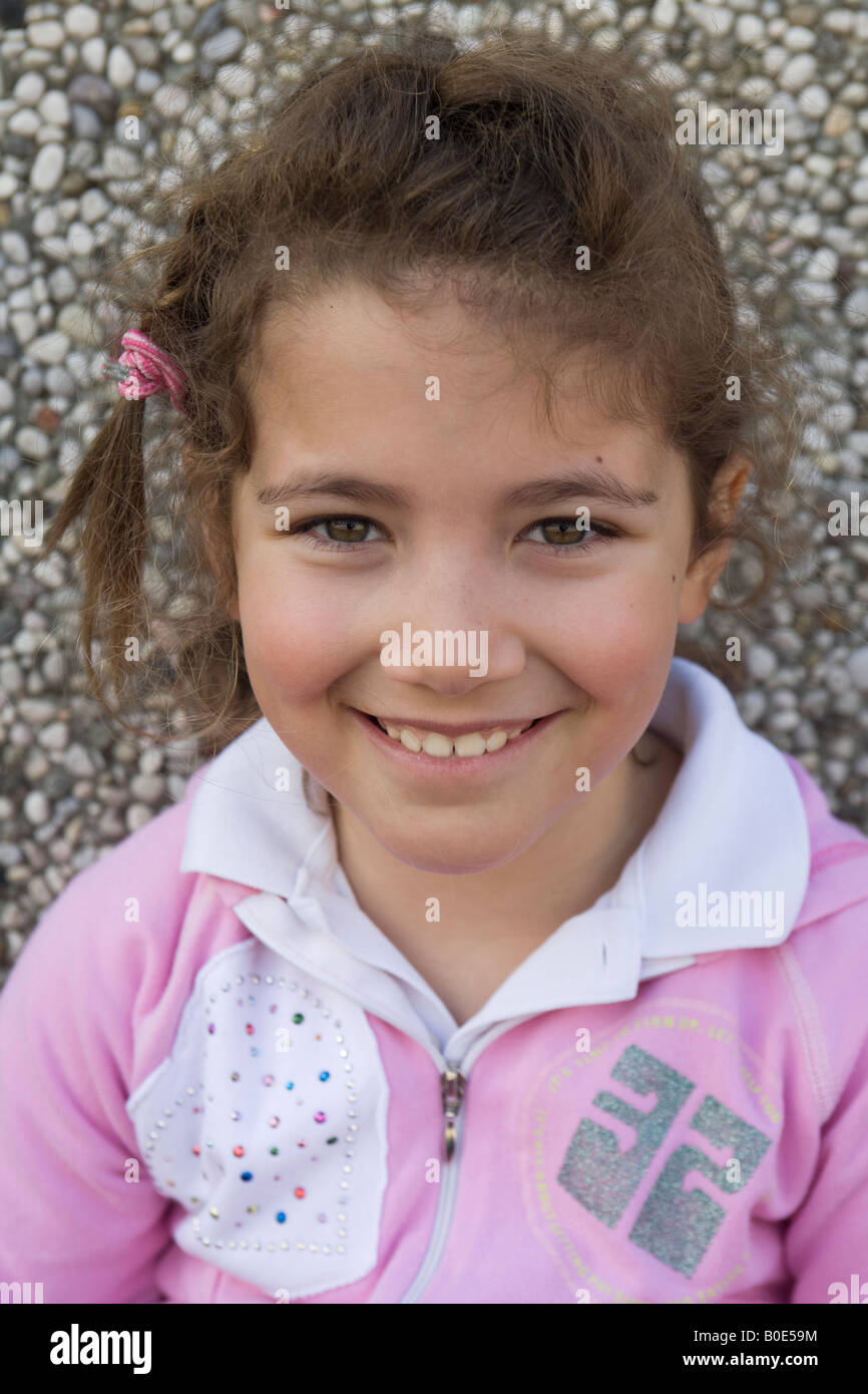 Portrait of a young little girl smiling to camera Stock Photo - Alamy