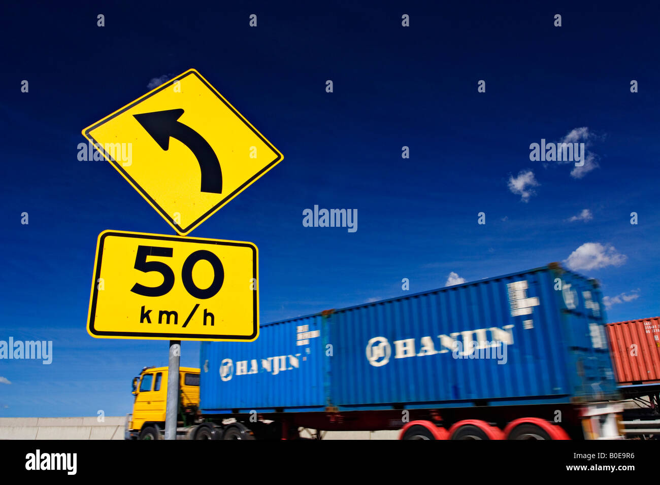 Transportation and Trucking  / A Container Truck commutes along a section of Freeway.Melbourne Victoria Australia. Stock Photo