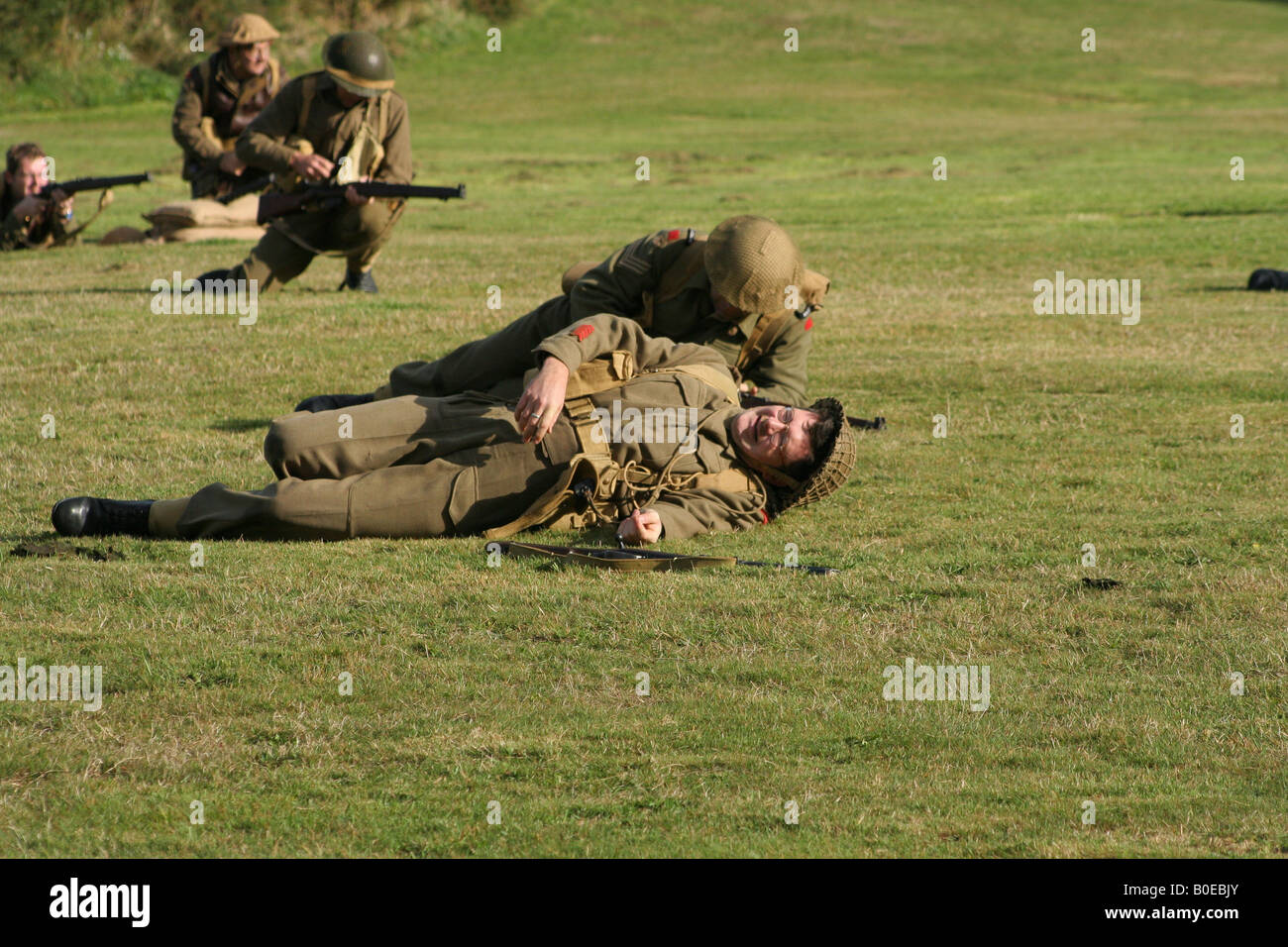 Wounded soldier in a WW-II battle scene re-enactment. Stock Photo