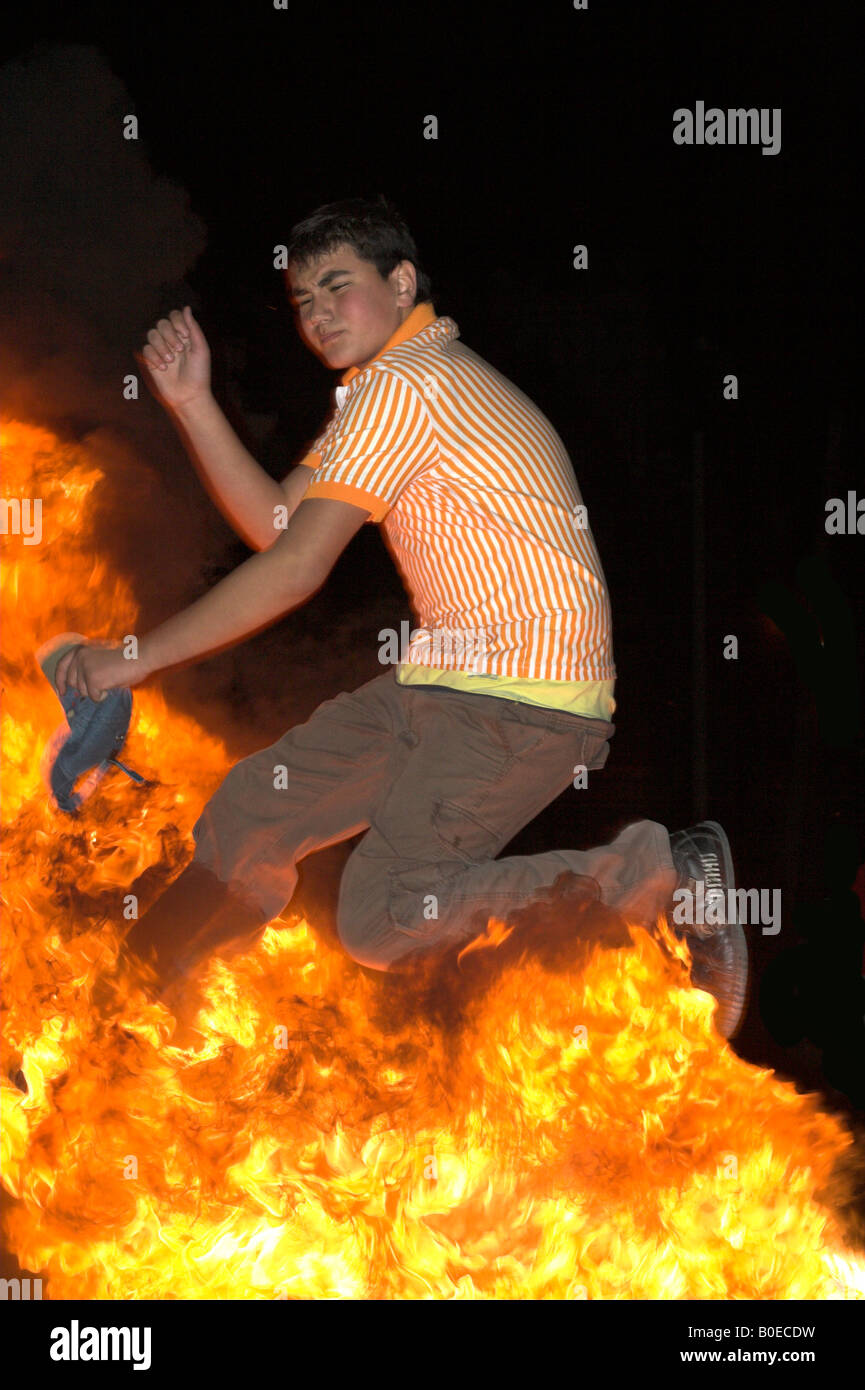 taken in izmir Turkey 05 05 2008 man jumps over fire celebrating the spring festive Hidrellez Stock Photo