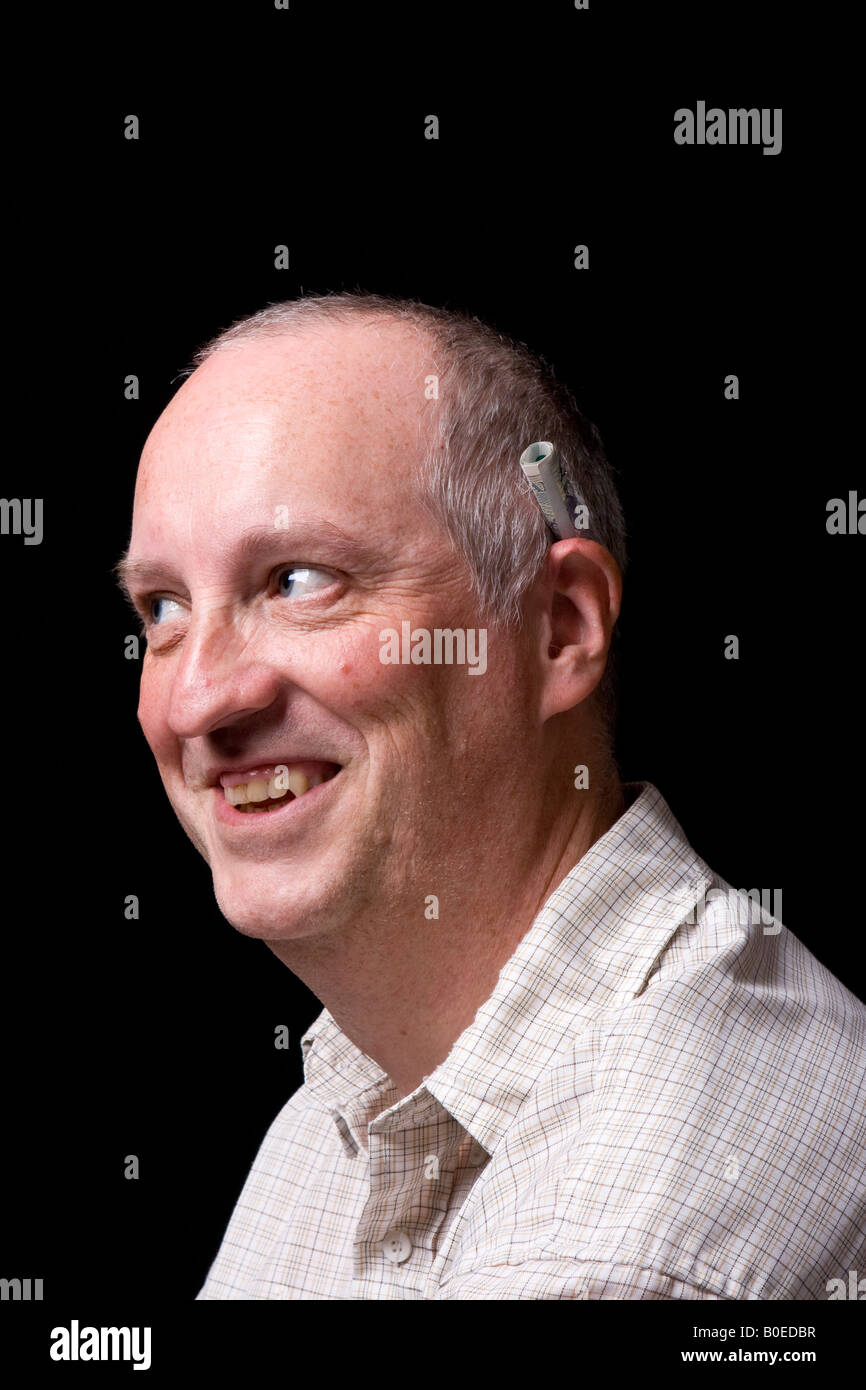 A man with a cigarette behind his ear, UK Stock Photo