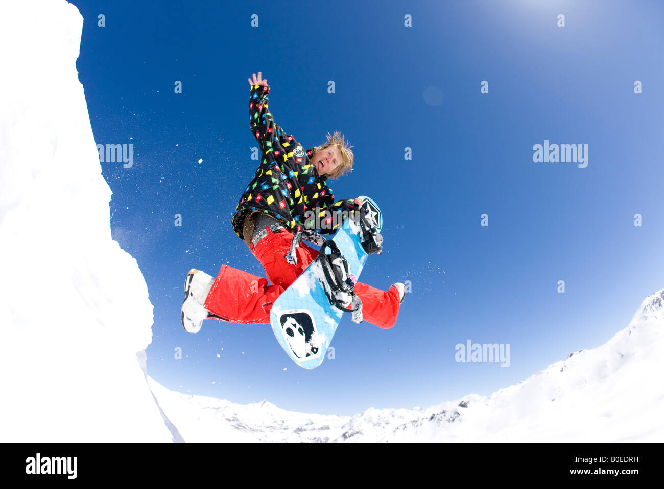 Snowboarder Jo Howard Air Guitar from Alpine jump. Stock Photo