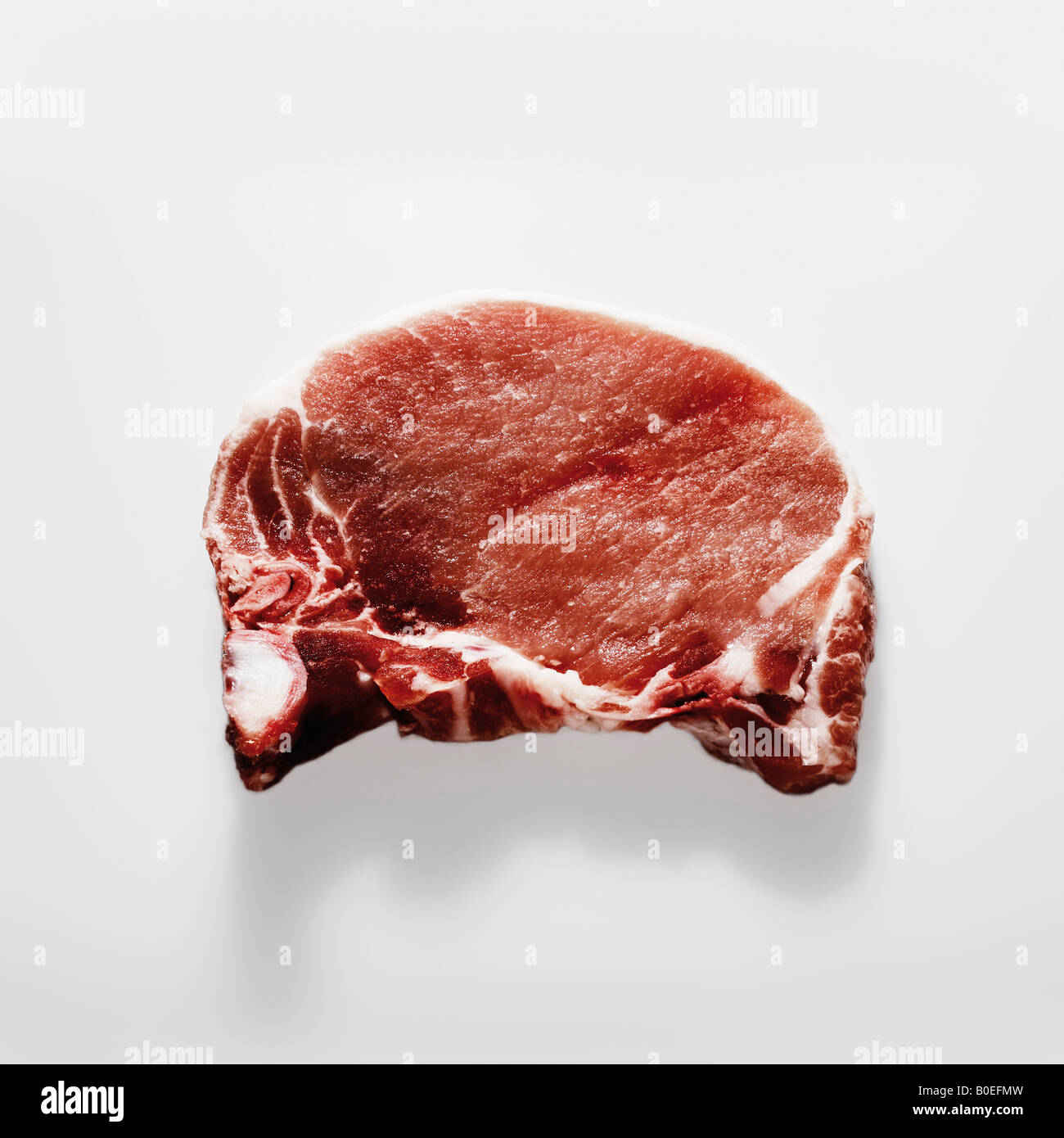 Raw meat / pork chop on white background Stock Photo