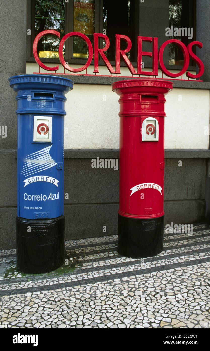 Red and blue post boxes outside Funchal's main Post Office, Madeira