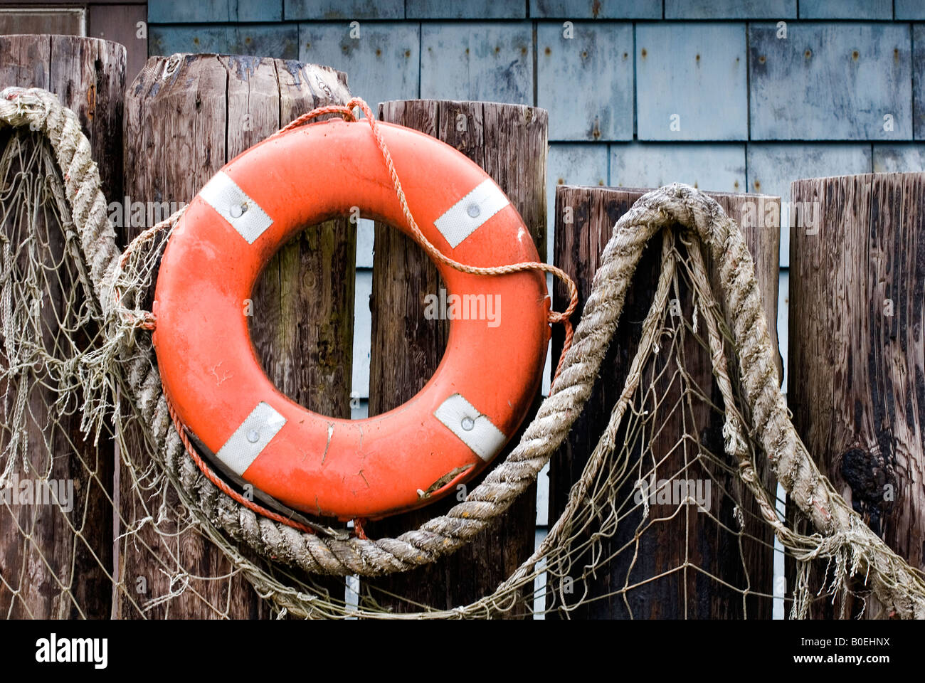 Life ring and fish netting create outdoor nautical decor on the Oregon  coast Stock Photo - Alamy