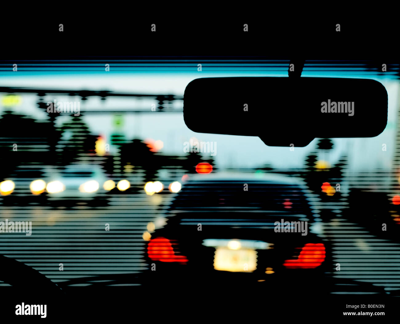 night traffic congestion seen through windshield textured with halftone pattern Stock Photo