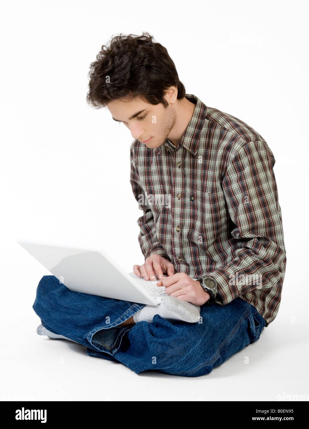 A young male teenager enjoys time on his computer Stock Photo - Alamy