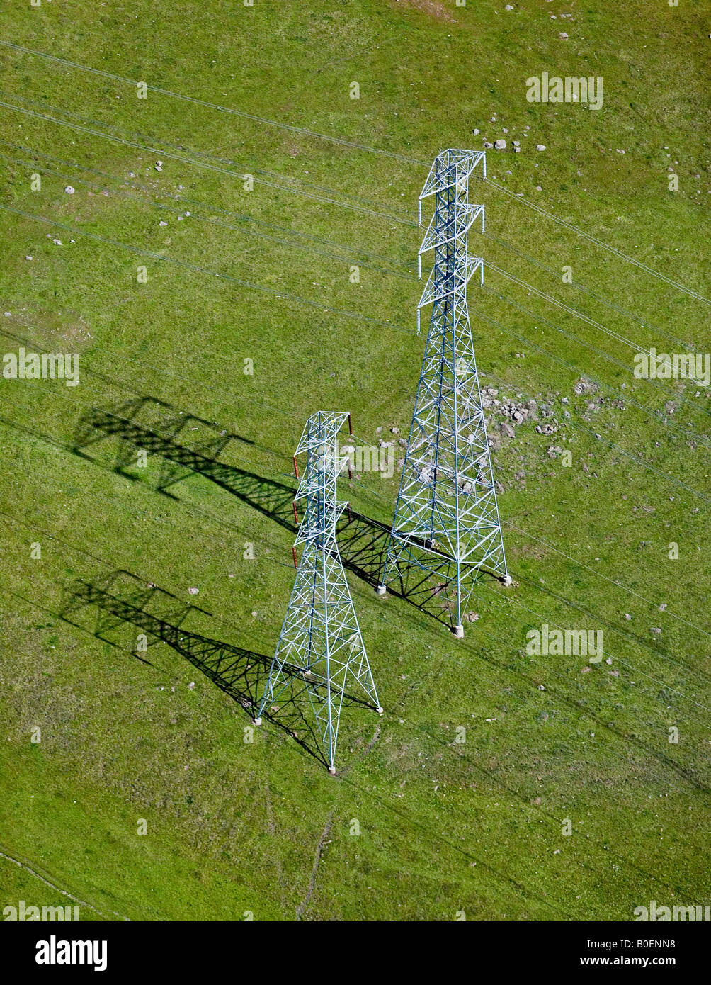 aerial above two Sonoma county California electrical transmission towers high voltage Stock Photo