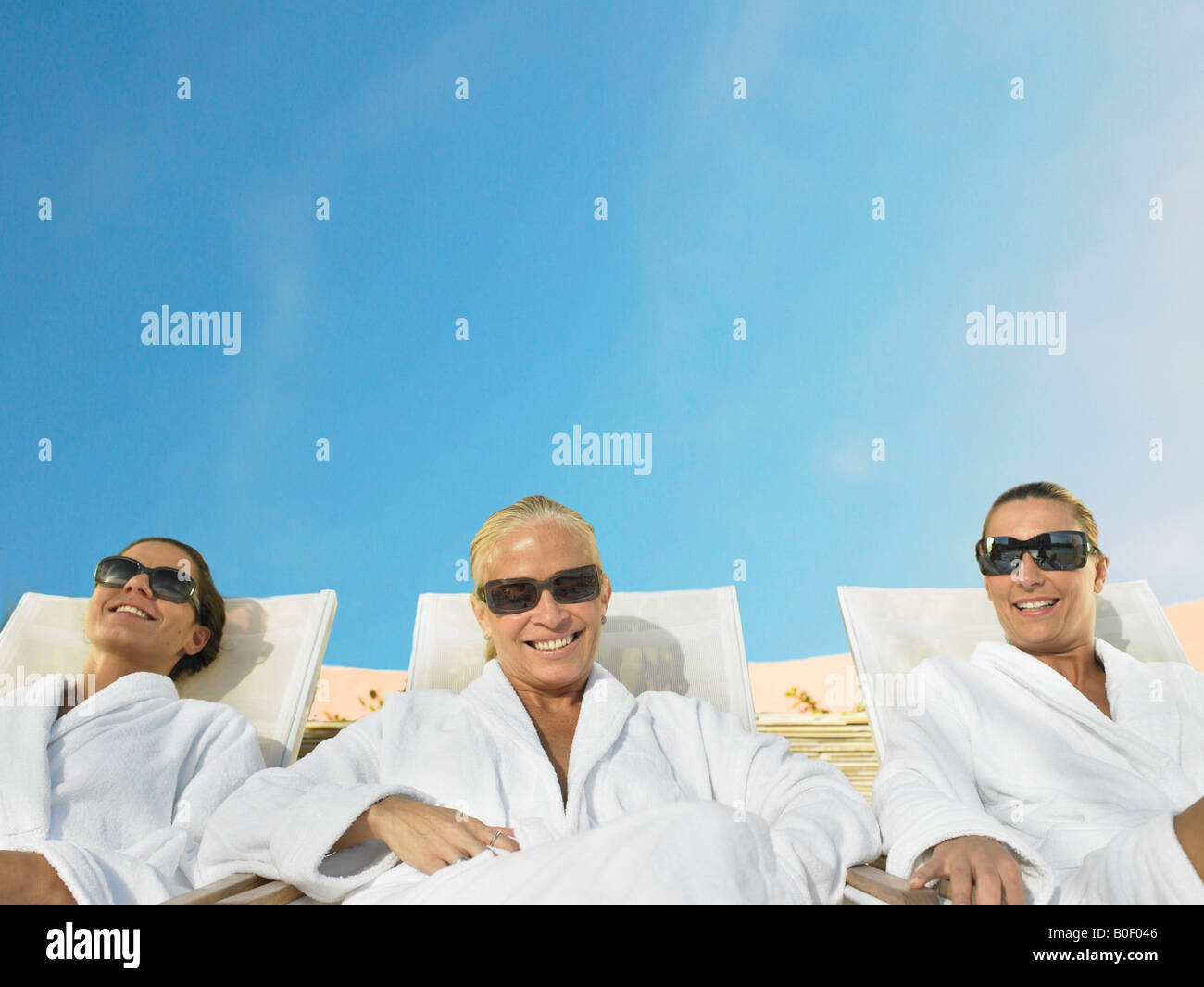 Carefree mature woman sunbathing hi-res stock photography and images ...