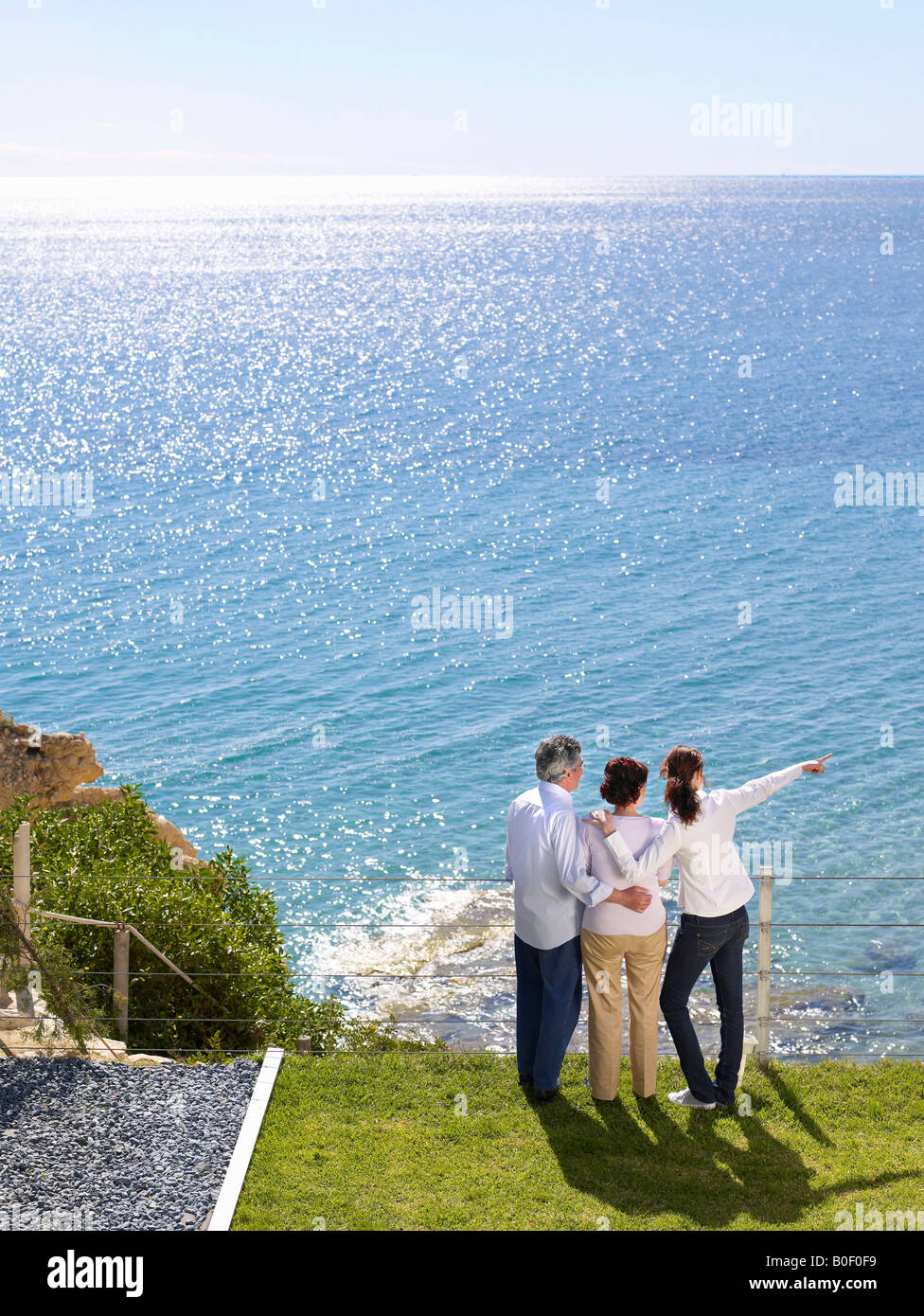 Family looking out to sea Stock Photo