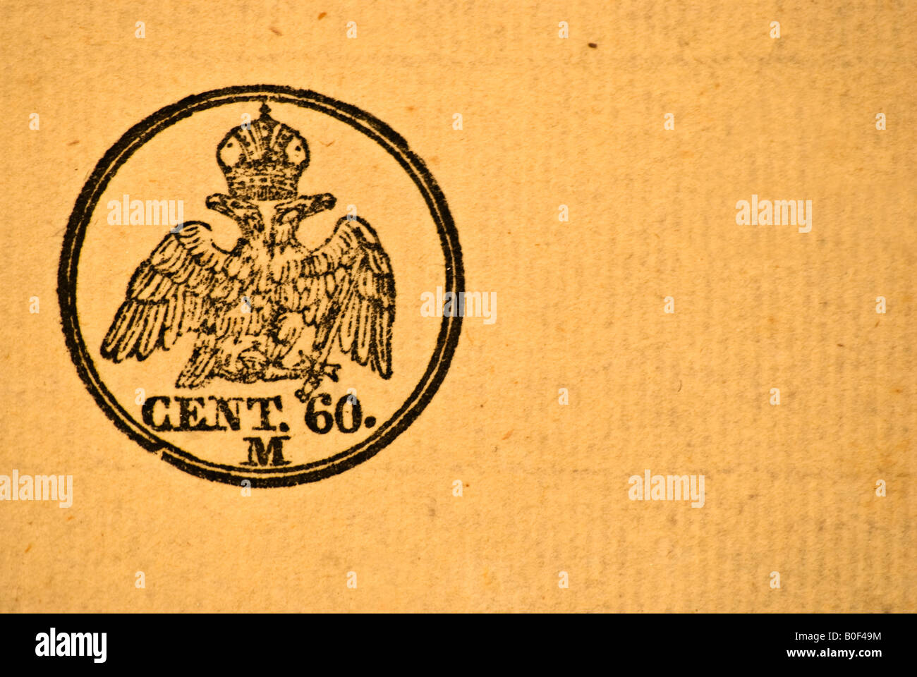Italian 60 cent stamp on an old letter containing a crown and a two heads eagle hanging a sword Stock Photo