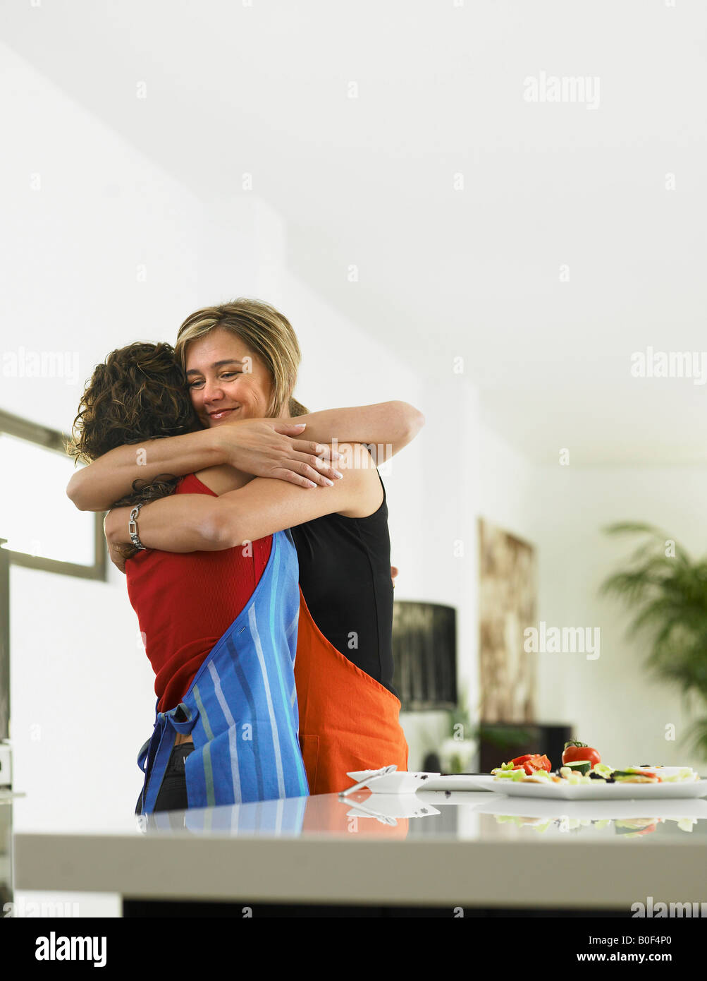 Mother and daughter embracing Stock Photo