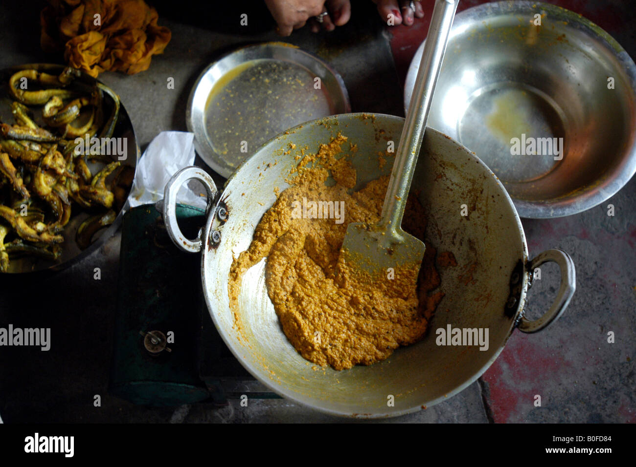 A traditional fish curry being cooked in mustard sauce in Bihar, India