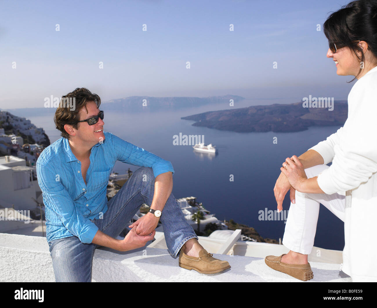 Couple talking, sea view Stock Photo