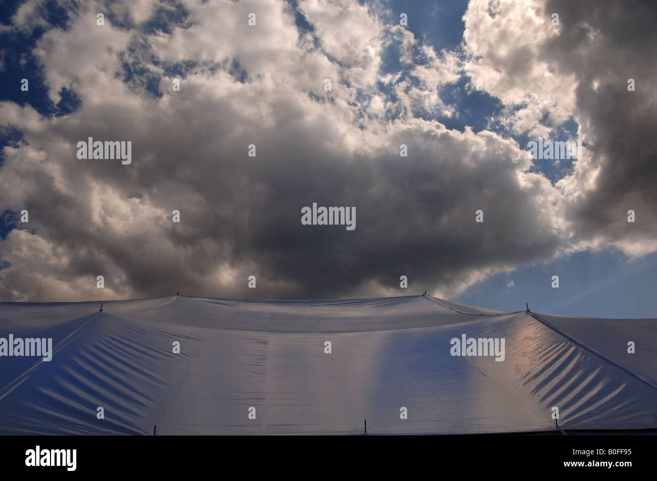 large tent with large clouds Stock Photo