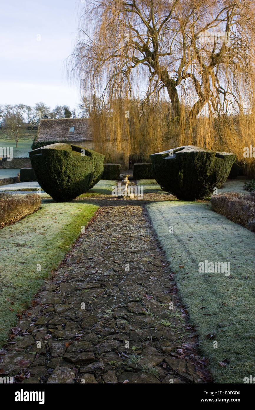 Frost covered country garden Swinbrook The Cotswolds Oxfordshire England United Kingdom Stock Photo