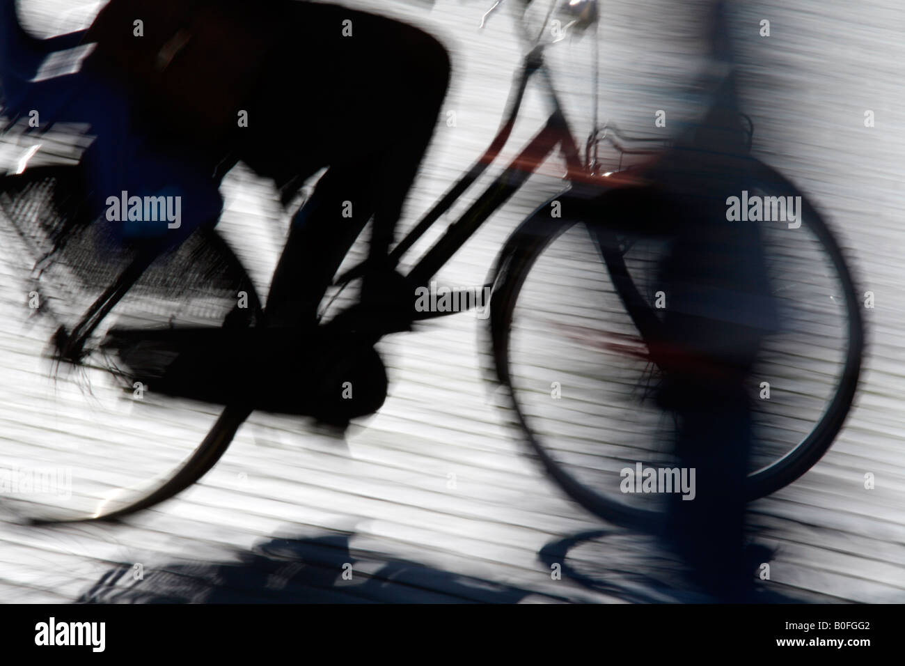 woman riding fast bike on street in town Stock Photo - Alamy