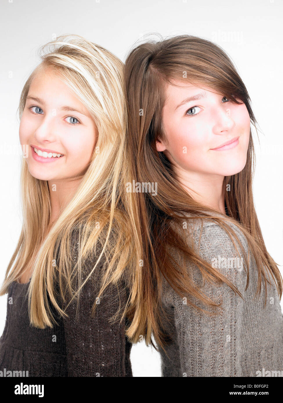 Girls smiling at the camera, portrait Stock Photo - Alamy